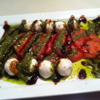 Engine No 9 - Caprese salad with sliced tomatoes, mozzarella balls, evoo, basil pesto, and balsamic vinegar. - Burgers Near Me - Saint Petersburg, Florida