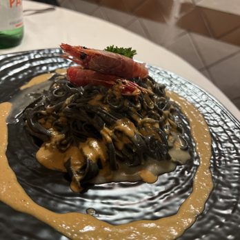 Osteria St. Ana - Tagliolini Neri al Limone e gamberi Rossi crudi (Black tagliolini pasta with lemon and raw red shrimp) - Italian Near Me - Rome, RM Osteria St. Ana - Tagliolini Neri al Limone e gamberi Rossi crudi (Black tagliolini pasta with lemon and raw red shrimp) - Italian Near Me - Rome, RM