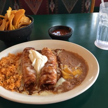 Puerto Vallarta - Sioux Falls - Mole Enchilada plate with chicken in it. - Mexican Near Me - Sioux Falls, South Dakota Puerto Vallarta - Sioux Falls - Mole Enchilada plate with chicken in it. - Mexican Near Me - Sioux Falls, South Dakota