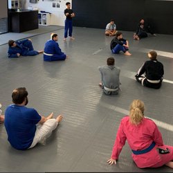 Risen Jiu Jitsu & Fitness - Coach James instructing adults class.
