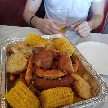 Live Crawfish & Seafood - Seafood boil with crab legs, extra sausage, corn, potatoes, and an unseen mountain of shrimp swimming in garlic. - Seafood Near Me - Richmond, Virginia