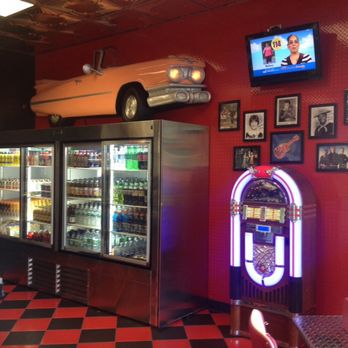 Everyday Bagel - a car on the wall above a vending machine - Bagels Near Me - Saint James, New York