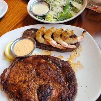 Outback Steakhouse - 12oz Ribeye* & Choice of Shrimp Caesar Side Salad - Steakhouses Near Me - Durham, North Carolina Outback Steakhouse - 12oz Ribeye* & Choice of Shrimp Caesar Side Salad - Steakhouses Near Me - Durham, North Carolina