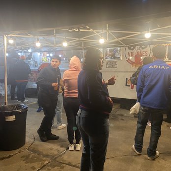 Tacos Los Viejones - a group of people at a food stand - Food Trucks Near Me - Denver, Colorado Tacos Los Viejones - a group of people at a food stand - Food Trucks Near Me - Denver, Colorado