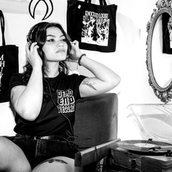 Dead End Records - Dead End Records listening to vinyl records.