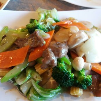 China Ben - beef, carrots, and broccoli on a white plate - Chinese Near Me - Red Deer, Alberta China Ben - beef, carrots, and broccoli on a white plate - Chinese Near Me - Red Deer, Alberta