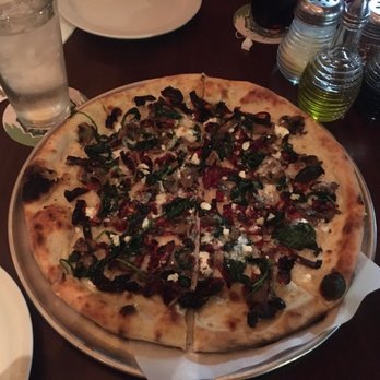 Tony's Pizzeria Teatro - Dolce Vita pizza, white sauce, spinach, sun dried tomatoes, goat cheese - Italian Near Me - Boise, Idaho Tony's Pizzeria Teatro - Dolce Vita pizza, white sauce, spinach, sun dried tomatoes, goat cheese - Italian Near Me - Boise, Idaho