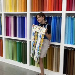 Authorized Vac And Sew - Showing off her pillowcase she made for her cat