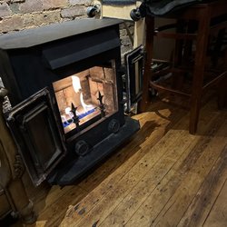 202 North Main Fine Wine Spirits & Music Room - Front wood stove keeping us cozy