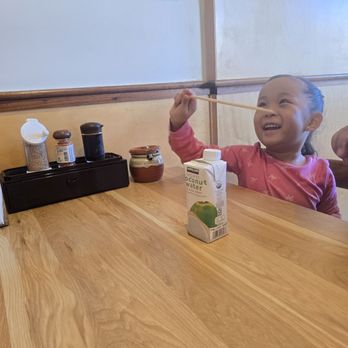 Don Maguro - Daughter enjoying chopsticks and coconut water - Japanese Near Me - San Diego, California