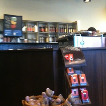 Starbucks - a coffee shop with a display of coffees - Coffee & Tea Near Me - Calgary, Alberta Starbucks - a coffee shop with a display of coffees - Coffee & Tea Near Me - Calgary, Alberta