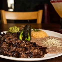 El Diablo Mexican restaurant - A traditional Mexican meal and a drink served on a wooden table in a warm dining setting