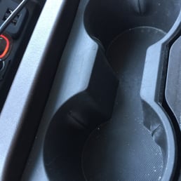 Dirt still in unwiped cup holders Dirt still in unwiped cup holders