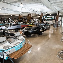 Action Water Sports showroom features MasterCraft, Cobalt, and Barletta Pontoon boats