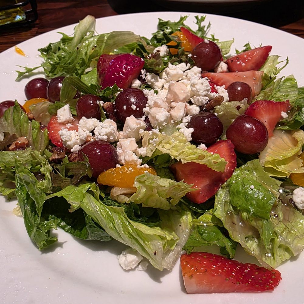 LongHorn Steakhouse - Fresh salad with grapes, strawberries, walnuts and cheese in a bright vinegar dressing. - Steakhouses Near Me - Franklin, Massachusetts LongHorn Steakhouse - Fresh salad with grapes, strawberries, walnuts and cheese in a bright vinegar dressing. - Steakhouses Near Me - Franklin, Massachusetts
