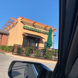 a view of a coffee shop from a car window a view of a coffee shop from a car window