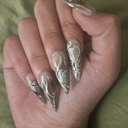 Asked for nude to black ombré with silver chrome cybersigilism detailing and gems. Couldn't be happier with the result! Asked for nude to black ombré with silver chrome cybersigilism detailing and gems. Couldn't be happier with the result!