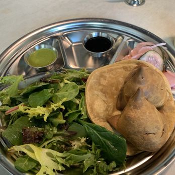 Lassi & Spice - Green salad with turmeric dressing, meaty samosas, flatbread, pickled vegetables, and chutney - Indian Near Me - Seattle, Washington