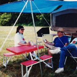 Iola Car Show - July, 1994: Rita Rinelli, Lou Rugani and John Vagnoni relax outside the Iola show/swap area on a perfect weekday.
