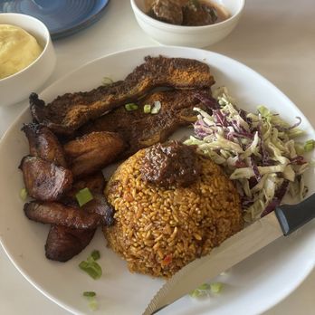 Gold Coast Ghal Kitchen - Jolof rice with beef ribs - African Near Me - Seattle, Washington Gold Coast Ghal Kitchen - Jolof rice with beef ribs - African Near Me - Seattle, Washington