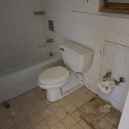 bathroom with toilet and tub bathroom with toilet and tub
