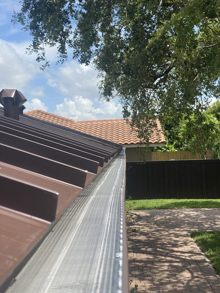 Slide of Jad Rain Gutters