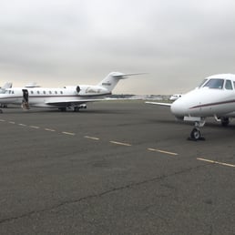 two private jets on the tarmac two private jets on the tarmac