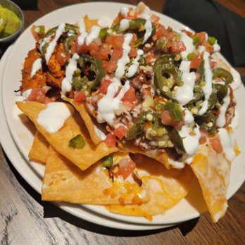 On The Kirb - Chicken nachos on happy hour menu. Really good. - Sports Bars Near Me - Houston, Texas On The Kirb - Chicken nachos on happy hour menu. Really good. - Sports Bars Near Me - Houston, Texas