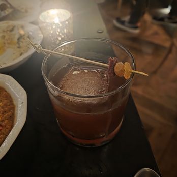 Suraya - $17 OBSCURED HOLLOWS - elijah craig bourbon, rittenhouse rye, sherry, brown butter, semolina & date - Lebanese Near Me - Philadelphia, Pennsylvania Suraya - $17 OBSCURED HOLLOWS - elijah craig bourbon, rittenhouse rye, sherry, brown butter, semolina & date - Lebanese Near Me - Philadelphia, Pennsylvania