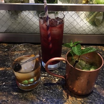 Earls Kitchen + Bar - Cucumber Mule, a raspberry drink, and another old fashion. - New American Near Me - McLean, Virginia Earls Kitchen + Bar - Cucumber Mule, a raspberry drink, and another old fashion. - New American Near Me - McLean, Virginia