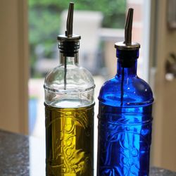 Couronne Company - Home or commercial kitchens can dispense oils, vinegar, or sauces from this recycled glass bottle with an embossed olive branch motif.