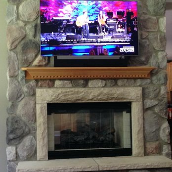 CWC Smart Homes - TV Mounted on Stone with SONOS Playbar - Home Theatre Installation Near Me - Clawson, Michigan CWC Smart Homes - TV Mounted on Stone with SONOS Playbar - Home Theatre Installation Near Me - Clawson, Michigan