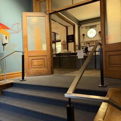 Coat Check Coffee - Entrance (when entering from outside, go up the stairs to the left)