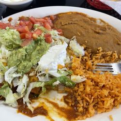 El Jimador - 4 enchiladas, rice, beans, salad, guacamole and sour cream.
