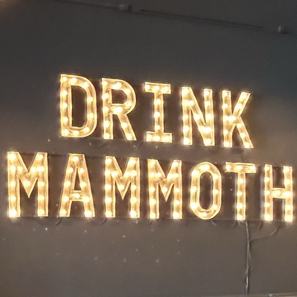 a sign that says drink mammoth