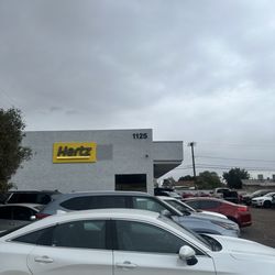 Hertz Rent A Car - Lot full of cars. Saying they have no cars available    - stay away.  Liars