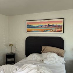 Tecopa Hot Springs Resort - Bed with two night stands, screened in patio and picnic table.