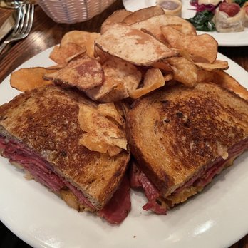 The Griswold Inn - "Corned Beef Reuben" (thick-sliced marble rye, braised kraut, melted Gruyère and Thousand Island dressing) with Potato Chips - Hotels Near Me - Essex, Connecticut The Griswold Inn - "Corned Beef Reuben" (thick-sliced marble rye, braised kraut, melted Gruyère and Thousand Island dressing) with Potato Chips - Hotels Near Me - Essex, Connecticut