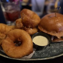 Blackberry bacon burger with tempura onion rings