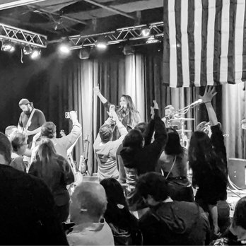 The Lime - a black and white photo of a band performing on stage - Sports Bars Near Me - Kirkland, Washington