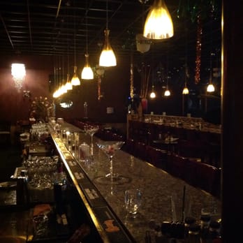 Allegro Bistro - a long bar with many empty glasses - Pizza Near Me - Venice, Florida