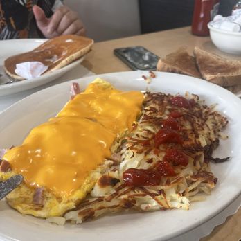 Hot Off the Grill - Ham and Cheese Omelette and half eaten short stack in the back - Fast Food Near Me - Fountain Valley, California Hot Off the Grill - Ham and Cheese Omelette and half eaten short stack in the back - Fast Food Near Me - Fountain Valley, California