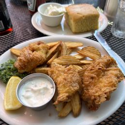 Three piece Fish and Chips and a piece of Cornbread. Three piece Fish and Chips and a piece of Cornbread.