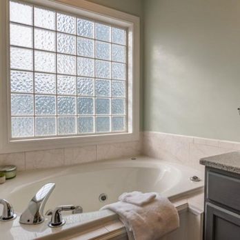 Tam Bay Construction - a bathroom with a bathtub and sink - Drywall Installation & Repair Near Me - Tampa, Florida Tam Bay Construction - a bathroom with a bathtub and sink - Drywall Installation & Repair Near Me - Tampa, Florida