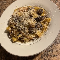 Pasta Volare - Tagliatelle with seasonal mushroom sauce buried under a whole lotta Parmagiano-Reggiano