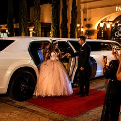 Deluxe Limousine Service - Her Quince, her moment. Red carpet arrival in our white stretch limo -- Quinceañera packages across Orange County.