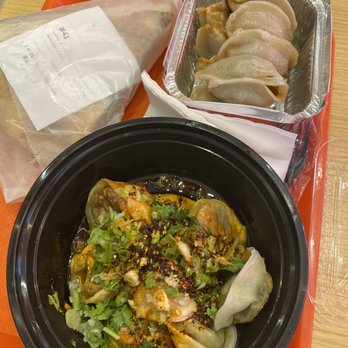 Vanessa's Dumpling House - Spicy spinach fried dumpling up front , 1. Chive and Pork Pan Fried Dumpling in the back and 24. Sesame Pancake Sandwich with Vegetable - Chinese Near Me - New York, New York Vanessa's Dumpling House - Spicy spinach fried dumpling up front , 1. Chive and Pork Pan Fried Dumpling in the back and 24. Sesame Pancake Sandwich with Vegetable - Chinese Near Me - New York, New York