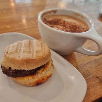 Dear Diary Coffee - Sausage biswich with a cinnamon roll latte - Coffee & Tea Near Me - Austin, Texas