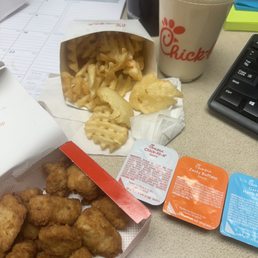 Nuggets and waffle fries with a frosted lemonade Nuggets and waffle fries with a frosted lemonade