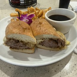 French dip with melted Swiss cheese and grilled onions and garlic fries. French dip with melted Swiss cheese and grilled onions and garlic fries.